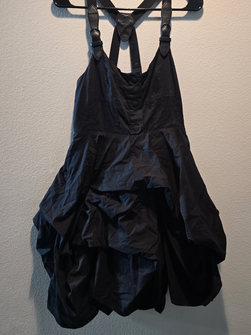 Black AllSaints Melody Amikiri dress has a hitched parachute-style skirt.
